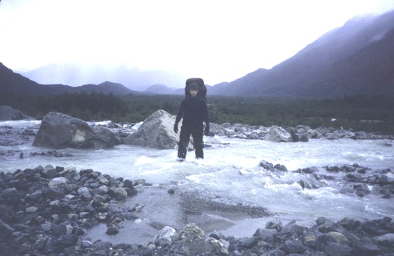 Joe crossing stream at landslide